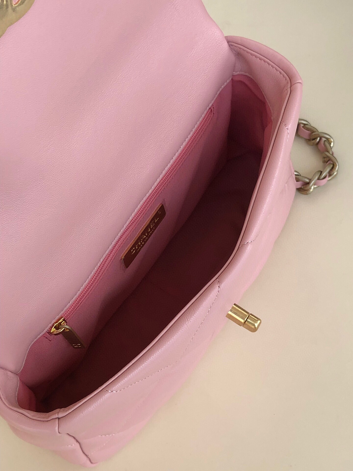 CHANEL 19 HANDBAG Shiny Leather, Gold-Tone, Silver-Tone & Ruthenium-Finish Metal Light Pink 6.2 × 10.1 × 3.5 in