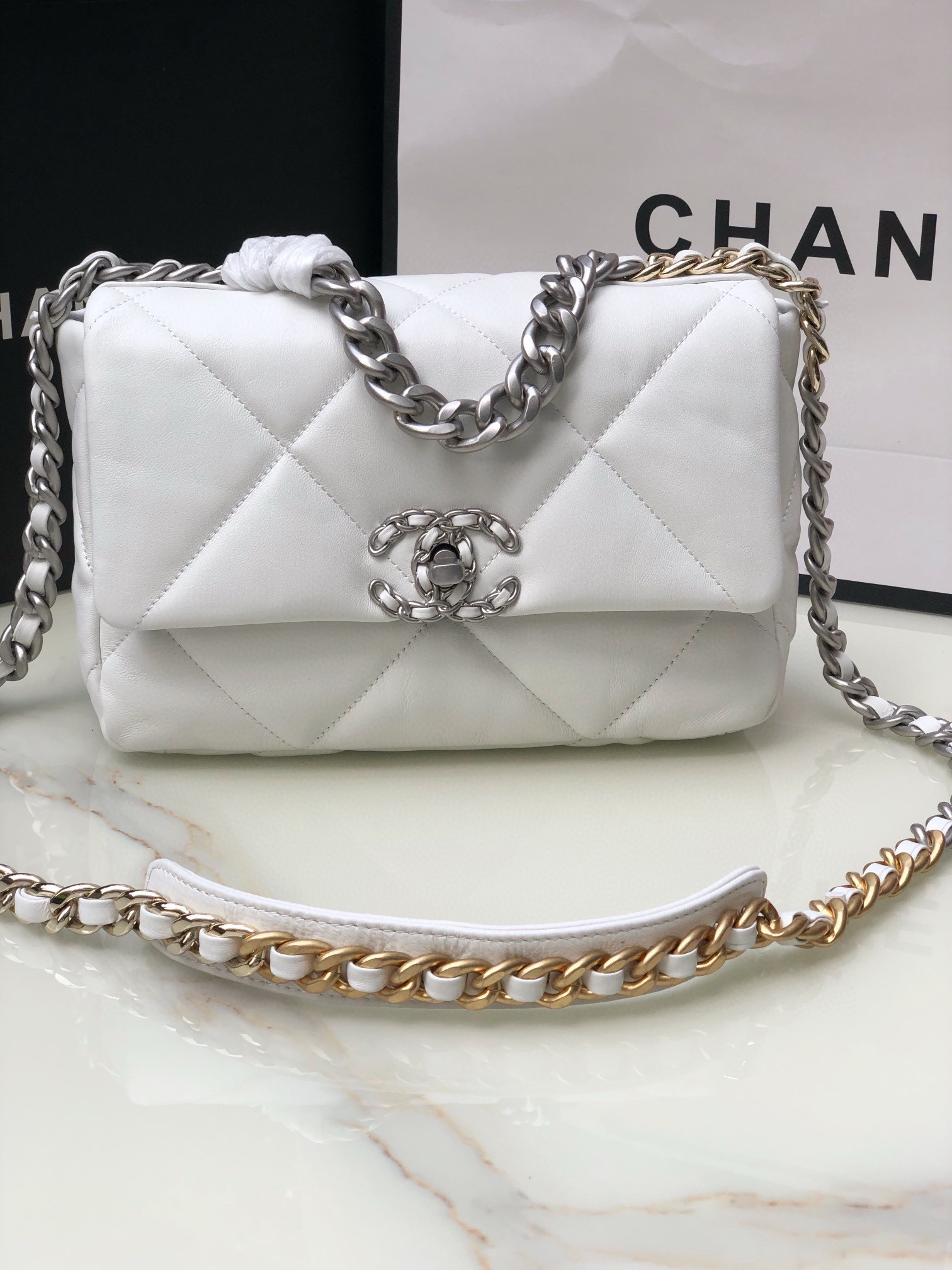 CHANEL 19 HANDBAG Shiny Leather, Gold-Tone, Silver-Tone & Ruthenium-Finish Metal White 6.2 × 10.1 × 3.5 in