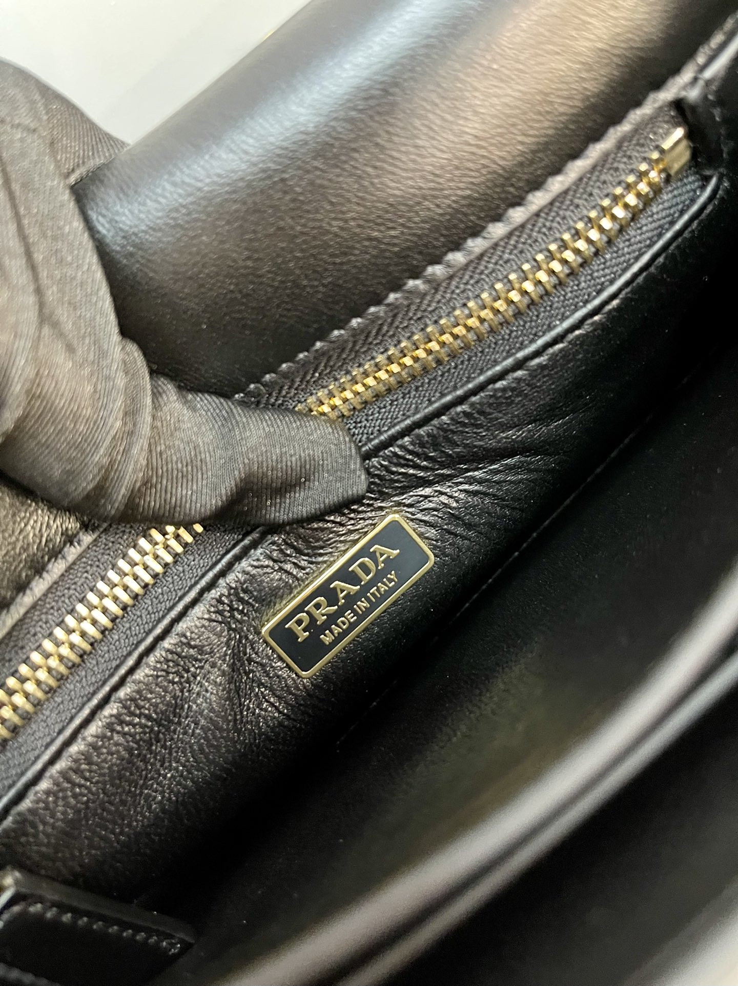 Prada Soft Sound small leather shoulder bag with charm 13.5x24x6cm