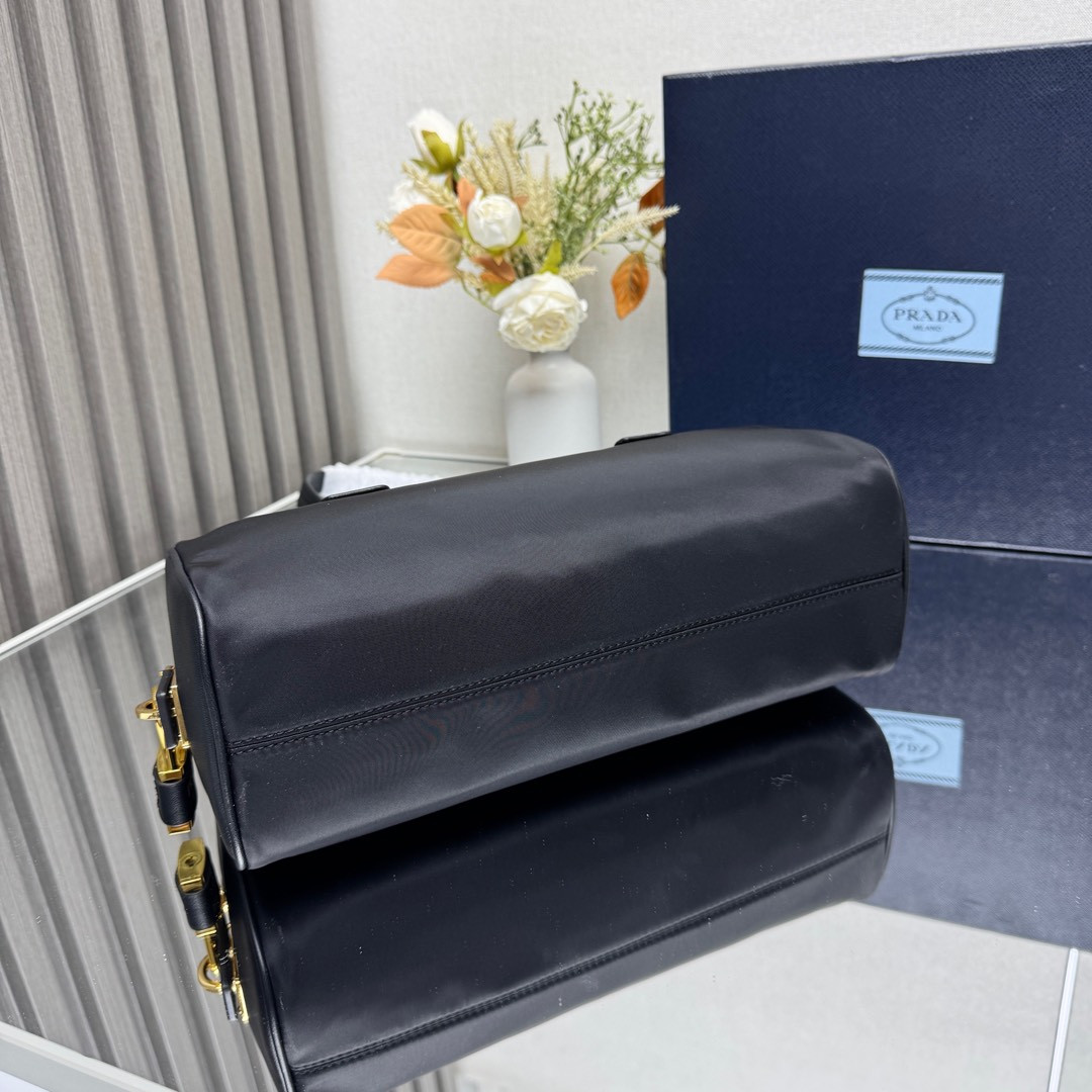 Prada Re-Nylon and leather medium top-handle bag with padlock 12.5x29x10cm